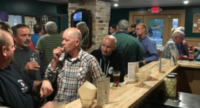 customers talking and drinking craft beer at Ambition Brewing